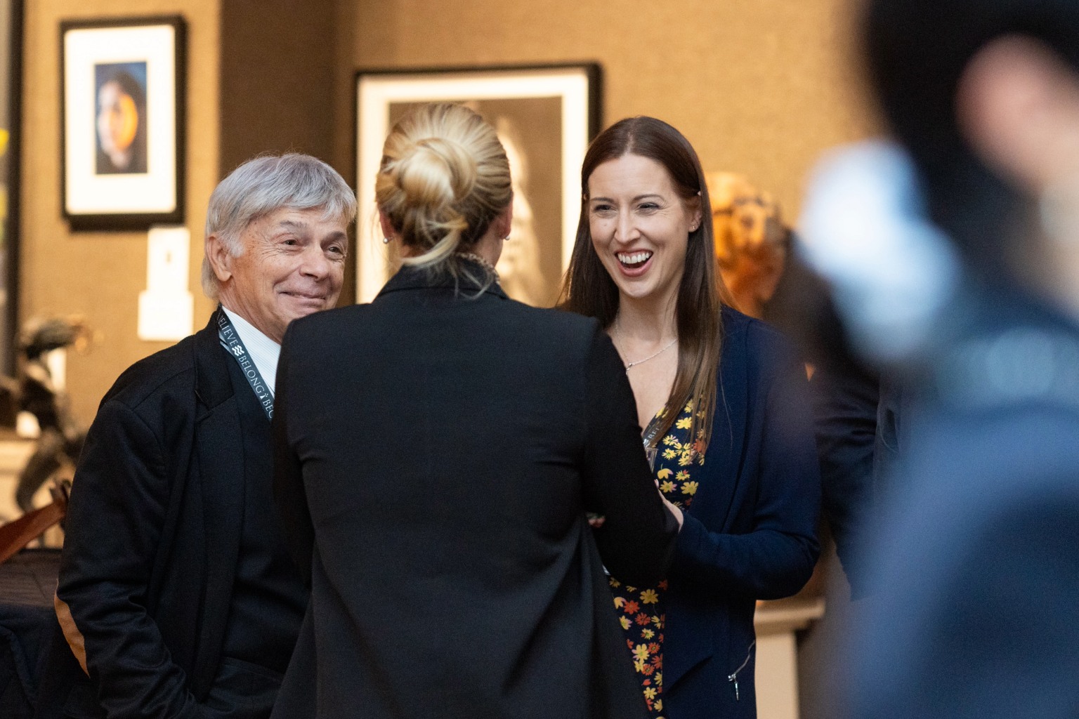 Rachelle Stretch speaking with alumni at the Trinity Hall Anniversary drinks event in New York