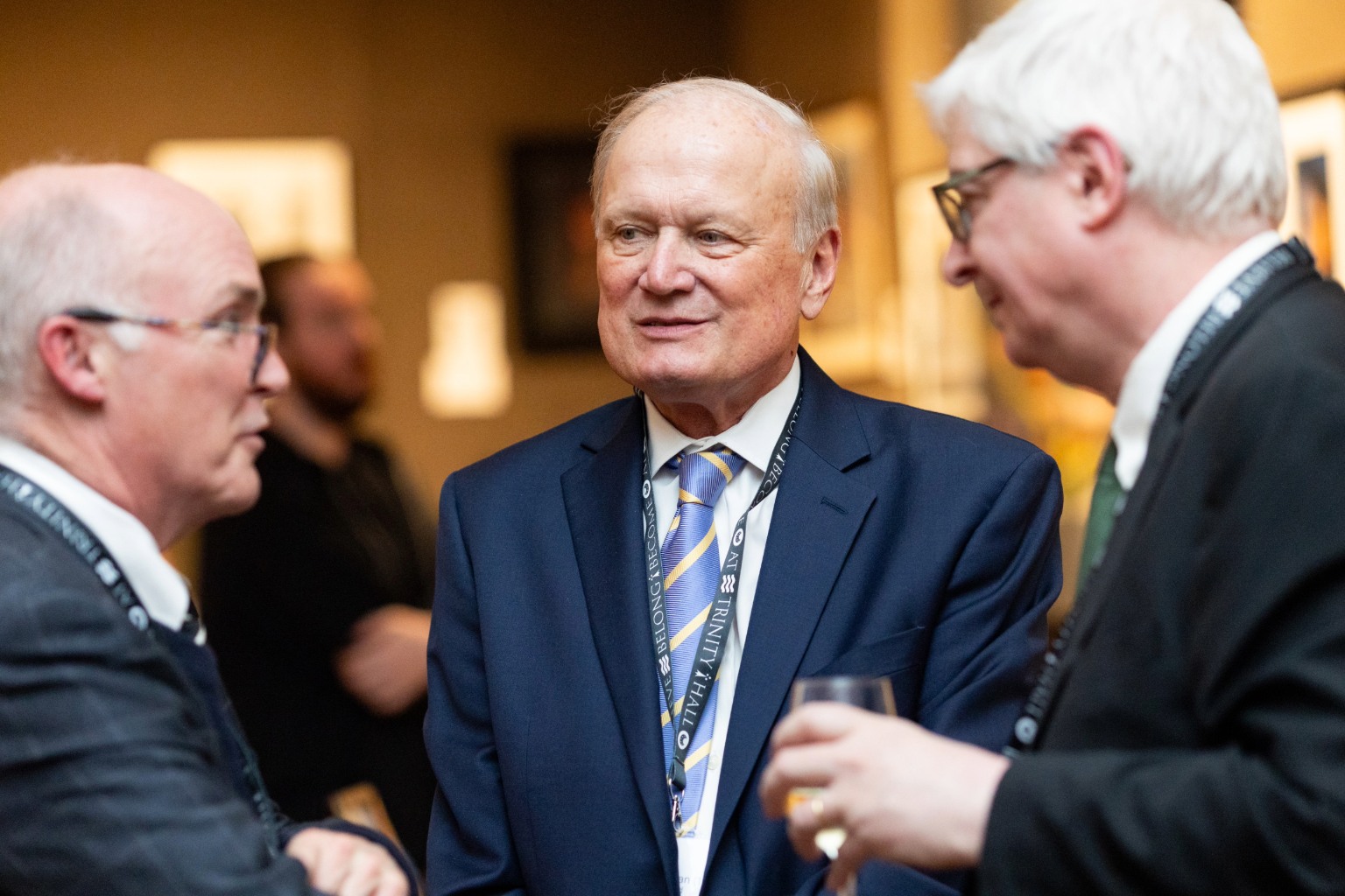 Frank Morgan in conversation with alumni at the Trinity Hall Anniversary Drinks in New York