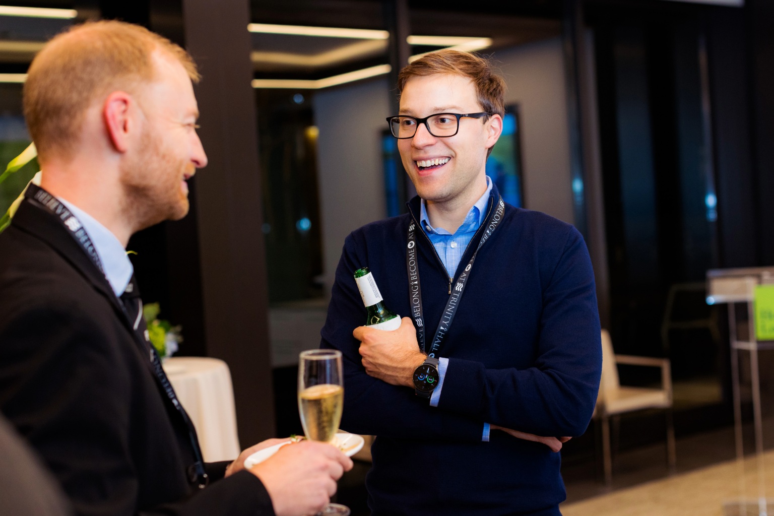 Two men in conversation at Trinity Hall's Anniversary drinks in DC.